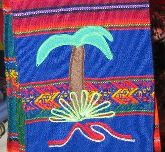 Calle Coln, centro artesanal,
                                  tejido sobre Arica, palmera con mar