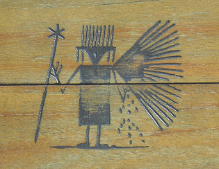 Extraterrestrial with wings, antennas and
                  triangular head on the board of the passed town of
                  Tumipampa