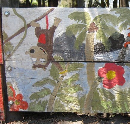 Affe mit Palmen, Blumen, Meer und
                          Felseninseln, Nahaufnahme