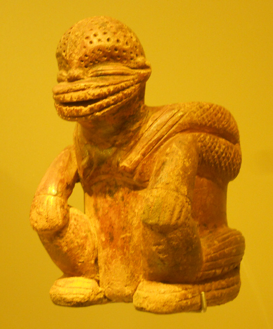 Columbia's Calima Culture: extraterrestrial
                        god with a dog's snout 01 with dashed eyes and a
                        perforated head