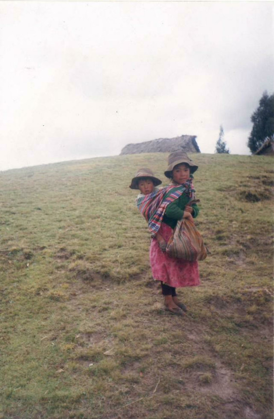 Girl with baby on her back