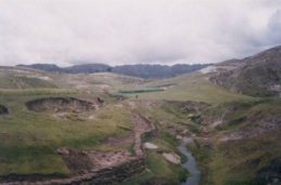 Country wall and brook / creek, fields in the
                      background