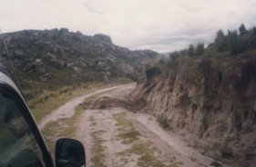 Miserable road conditions and heavy erosion
                      on the slope of the road