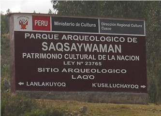 Cusco Sacsayhuamán 13, the walk to "Zone X" (Laco, Moon Temple), street with trees and signpost to "Zone X" resp. "Laq'o" (Laco) - zoom Cusco Sacsayhuamán 13, the walk to "Zone X" (Laco, Moon Temple), street with trees and signpost to "Zone X" resp. "Laq'o" (Laco) - zoom