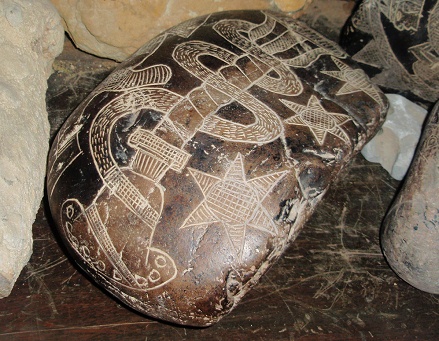 The stone with the
                  snake in form of a DNA