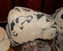 A dinosaur eating a lizard, and there is
                          also a wise man