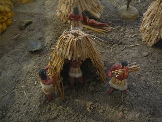Model of Stone Age houses under
                                    construction