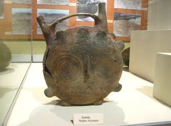 Una cara de la botella de cara
                                  doble (cara humana)