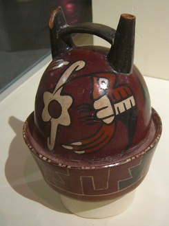 Ceramic bottle of Nazca culture
                                  with hummingbirds (01) flying around a
                                  flower, close-up 03