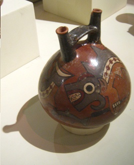 Ceramic bottle of Nazca culture
                                  with a killer wale (orca), close-up of
                                  the teeth