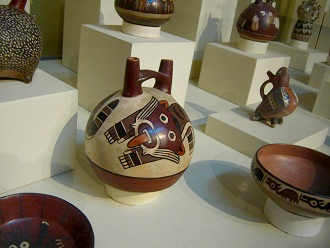 Ceramic bottle with the head of
                                    the wild cat