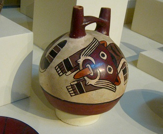 Ceramic bottle with the head of
                                    the wild cat, close-up