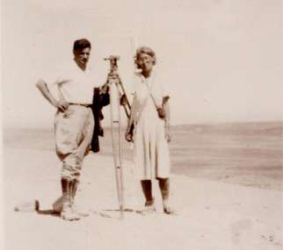 Maria Reiche with
                        Paul Kosok measuring lines of Nasca, 1940s