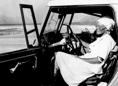 Maria Reiche in the car in the
                desert plain, in the 1970s about