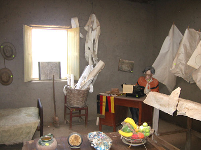 The
                          room of Maria Reiche is yet in this order as
                          it had been left, a part of the Maria Reiche
                          museum, where Maria Reiche is represented
                          writing on her desk, surrounded with many
                          plans and a German honoured flag. The papers
                          were left as they were at her death. This is
                          all unfinished research... [15]