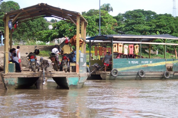 Port of Puerto Maldonado with
                ferries with swim wests